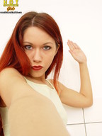 handheld red_hair point_of_view looking_at_viewer raised_hand
