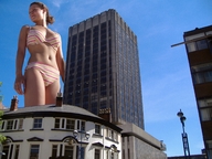 giantess collage panties bra buildings low_angle short_hair unknown_artist belly sky