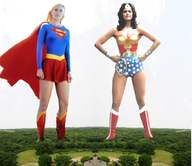 breasts giantess collage mega blonde black_hair cleavage skirt boots supergirl giantesses wonder_woman cape leotard tiara hands_on_hips helen_slater lynda_carter lasso dc_comics