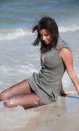 giantess beach brunette shrunken_men waves sitting_on_beach tide