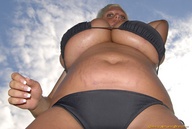 giantess blonde large_breasts stomach looking_down clouds sky point_of_view greasy