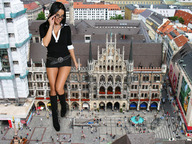 giantess collage city black_hair clothed glasses smiling short_skirt looking_at_viewer knee_high_boots crowds