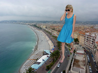giantess collage city blonde beach ocean dress walking sunglasses people coast docop taylor_swift grey_clouds
