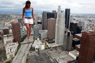 giantess collage city legs shorts walking looking_down skyscrapers clouds blue_top tattooed