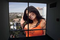 giantess collage city black_hair cleavage buildings smiling wave jr looking_in