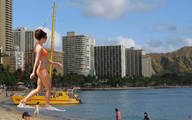 bikini giantess collage beach jr shrunken_people sunglasses hotels source_needed tour_boat wading beach_front hillside orange_swim_suit apartment_buildings seaside