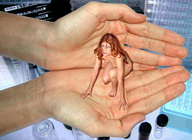 collage nude handheld finger red_hair kneeling hand shrunken_woman captured looking_at_viewer laboratory