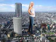 giantess collage city blonde clothed unknown_artist skyscraper looking_at_viewer