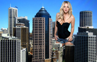 giantess city blonde shorts skyscrapers sky sunny black_top looking_at_viewer docop kaley_cuoco