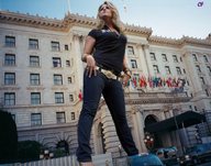 giantess collage blonde clothed standing vehicles looking_up cf flags government_building