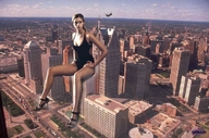 giantess collage city swimsuit high_heels buildings helicopter sitting clouds vortex_gts hands_on_hips