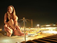 giantess collage barefoot smiling unknown_artist sitting airplane airport looking_at_viewer terminal