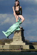giantess collage black_hair ocean unknown_artist open_mouth sunglasses people clouds statue_of_liberty holding_statue