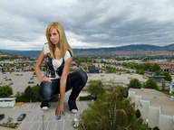 giantess collage blonde clothed wonderslug kneeling hand vehicles sneakers parking_lot looking_at_viewer crushed_car walmart stores