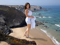 giantess collage clothed beach ocean high_heels brunette unknown_artist legs shrunken_people waves sand denise_milani looking_at_viewer downward_angle