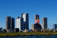 giantess collage city clothed unknown_artist sitting skyscraper sky behind_view distant