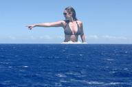 giantess collage mega black_hair ocean wet smiling wonderslug airplane waves sunglasses bikini_top ships kelly_brook pointing