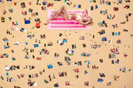 giantess blonde swimsuit beach barefoot wonderslug foot_print sand looking_at_viewer sunbathing downward_angle beach_goers candice_swanepoel
