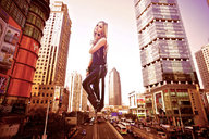 giantess collage city blonde clothed traffic buildings boots unknown_artist streets avril_lavigne clothing looking_at_viewer