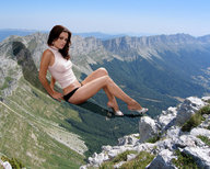 giantess collage landscape high_heels brunette sitting legs mountains looking_at_viewer accasbel rachel_bilsong turtleneck