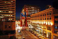drawing giantess collage city mega blonde skirt buildings wonderslug boots supergirl standing streets vehicles night costume cape looking_at_viewer belt street_lights maggie_grace dc_comics bare_legs