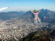 giantess collage landscape city blonde buildings wonderslug lying_down skyscraper mountains aerial_view looking_at_viewer