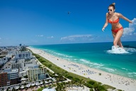 giantess collage swimsuit beach ocean buildings helicopter wonderslug belly sunglasses sand miley_cyrus wading beach_front beach_goers
