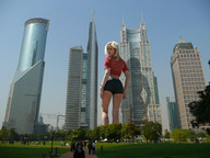 giantess collage city blonde clothed low_angle park wonderslug legs people skyscrapers sky looking_back trees looking_at_viewer behind_view