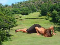 giantess vore brunette lying_down outdoors black_dress golf_course oblivious_bystanders