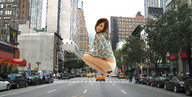 giantess city buildings brunette street vehicles crouching looking_at_viewer