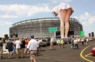 giantess collage buildings stadium unknown_artist legs people sky parking_lot leaning_forward