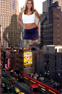 giantess collage city blonde skirt smiling wonderslug belly looking_at_viewer between_buildings