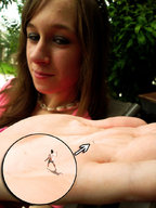 micro long_hair handheld brunette shrunken_men outdoors aware in_palm