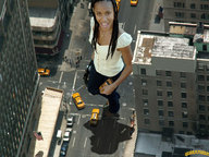 giantess collage city clothed buildings streets vehicles dark_skin looking_at_viewer rooftop downward_angle lowerrider jada_pinkett-smith holding_vehicle