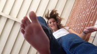 feet clothed barefoot soles brunette low_angle smiling looking_down photograph foot_pov point_of_view looking_at_viewer imminent_crush jungle_girl_emi