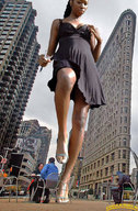 breasts giantess collage city mega clothed handheld buildings low_angle dress walking shrunken_man looking_down dark_skin necklace new_york_city lowerrider flatirons_building bare_legs