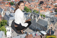 giantess collage clothed high_heels buildings brunette kneeling town looking_at_viewer courtyard rooftop irina_shayk rooftop_view downward_angle lowerrider