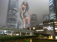 breasts giantess collage city mega low_angle wonderslug dress looking_down skyscraper looking_at_viewer megan_fox between_buildings hong_kong