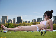 giantess collage city swimsuit barefoot brunette park lying_down legs skyscraper grass sunglasses people sunbathing lowerrider