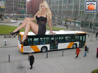 giantess collage blonde cleavage high_heels buildings sitting legs bus people looking_at_viewer squeezemeflat