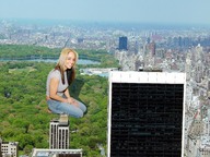 giantess collage city clothed smiling nikki park wonderslug kneeling skyscraper trees looking_at_viewer