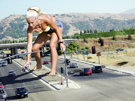 breasts giantess collage mega blonde barefoot cleavage wonderslug ponytail watch legs shorts highway vehicles road top bending_down kendra_wilkinson grabbing_car foot_prints