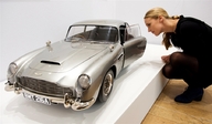 giantess collage blonde clothed shoes stockings kneeling vehicles looking_in db5 aston_martin james_bond