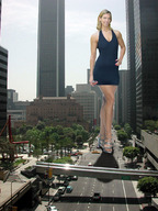 giantess collage city blonde high_heels smiling wonderslug dress skyscraper people streets vehicles looking_at_viewer holding_crushed_car cracked_pavement mile_high_mikayla