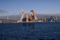collage city mega blonde bridge water buildings wonderslug lying_down clouds sky looking_at_viewer mira_sorvino