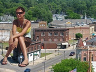 giantess collage feet city color clothed buildings wonderslug sitting sandals sunglasses outdoors flip_flops earrings looking_into_distance sitting_on_building