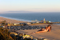 giantess butt swimsuit beach ocean wonderslug lying_down sand vehicles parking_lot resort nina_agdal santa_monica