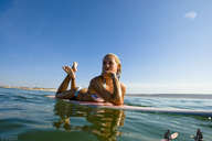 giantess collage blonde swimsuit small_men barefoot water lowerrider surfers surfboard