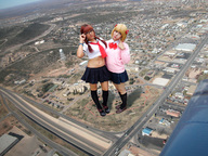 breasts giantess collage mega blonde clothed skirt buildings shoes socks red_hair belly uniform giantesses aerial_view looking_at_viewer downward_angle peque bare_midriff