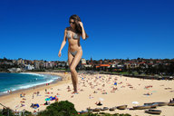 giantess collage swimsuit beach barefoot buildings brunette walking sunglasses sand sky resort selena_gomez beach_goers gus1212